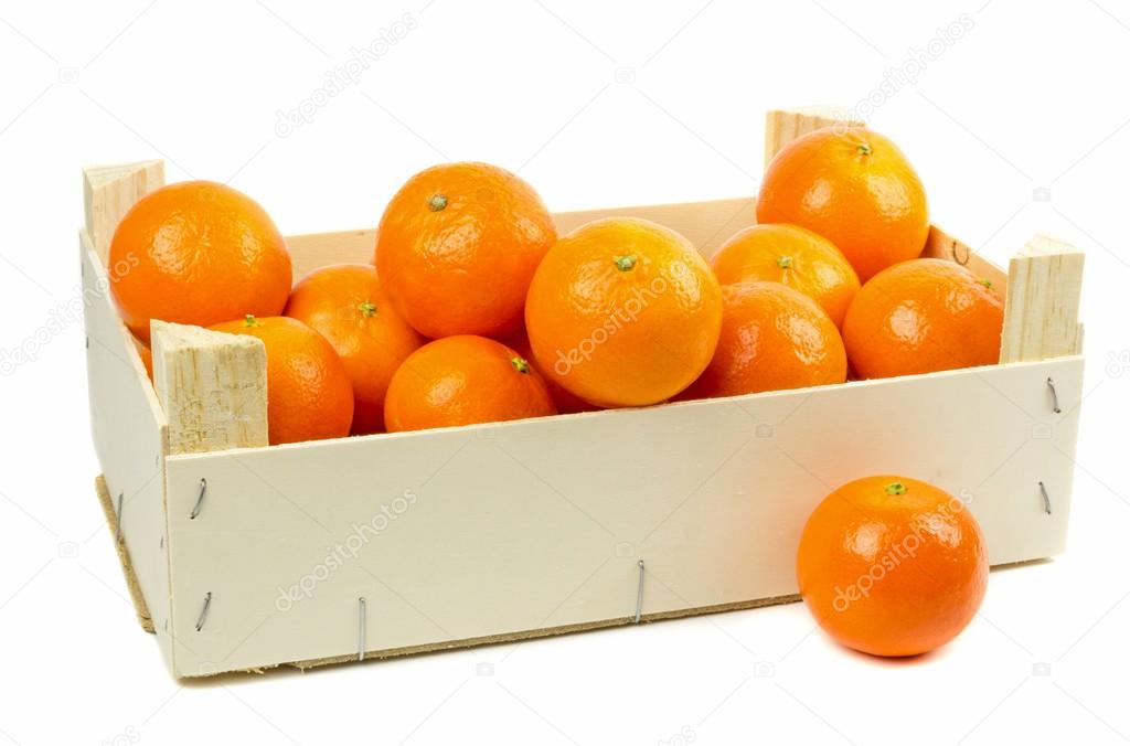 A wooden box of tangerines