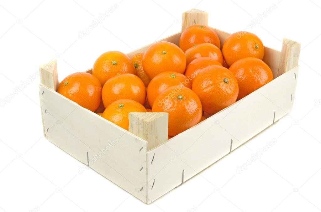 A wooden box of tangerines