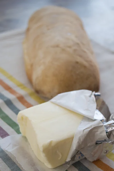 Pat van boter op een brood van brood — Stockfoto