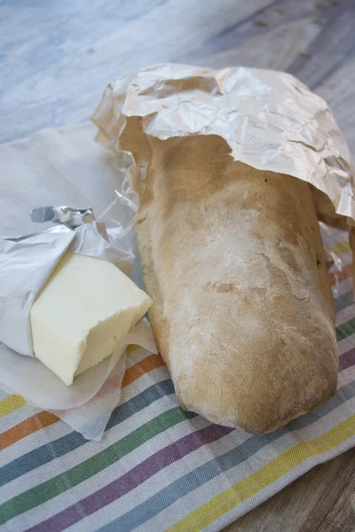 Pat van boter op een brood van brood — Stockfoto