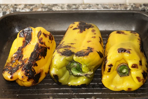 Peppers roasted on the griddle 스톡 사진