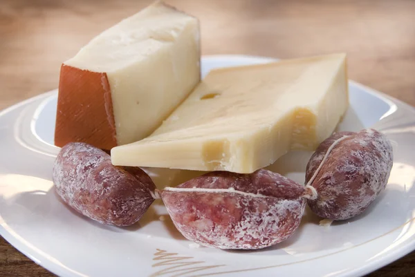 Cheeses and salamini — Stock Photo, Image