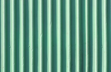 Yeşil çit oluklu metal duvar arka plan.