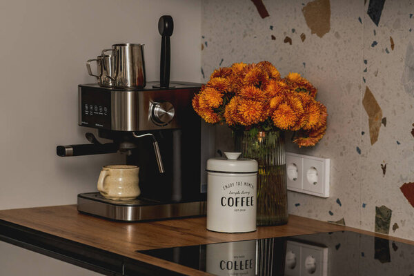 Home Espresso Machine with Mug and Coffee Canister in Cozy Kitchen