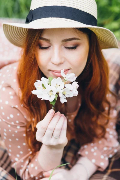 Young Beautiful Red Haired Girl Walks Spring Blooming Apple Orchard Stock Photo