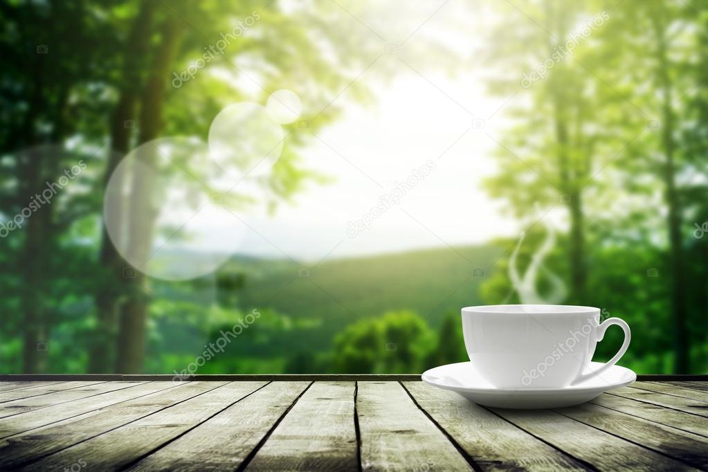 Cup With Tea On Table Over Mountains Landscape With Sunlight Stock Photo Image By C Robertsrob Cup With Tea On Table Over Mountains Landscape With Sunlight Stock Photo Image By C Robertsrob