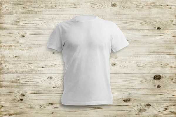 Grey shirt over wood background — Stock Photo, Image