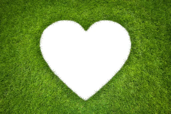 Forma de corazón en fondo de hierba verde — Foto de Stock