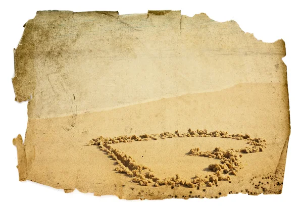 Paper with heart on sand — Stock Photo, Image