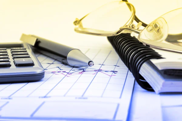 Notebook, glasses, pen and calculator — Stock Photo, Image