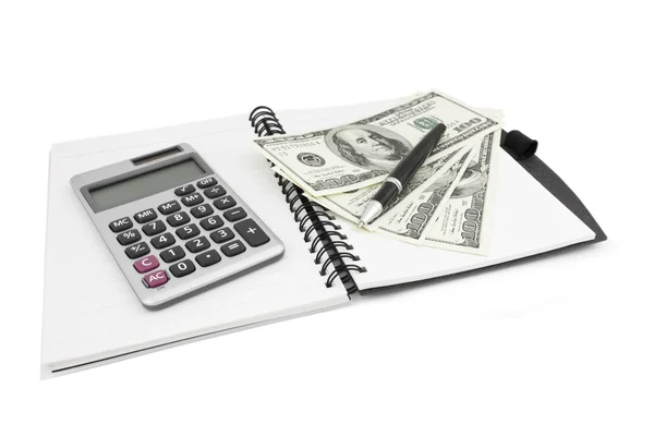 Pen, calculator and dollars on notebook — Stock Photo, Image