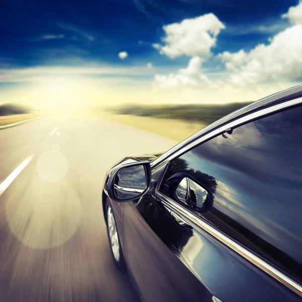 Blurred road and car — Stock Photo, Image