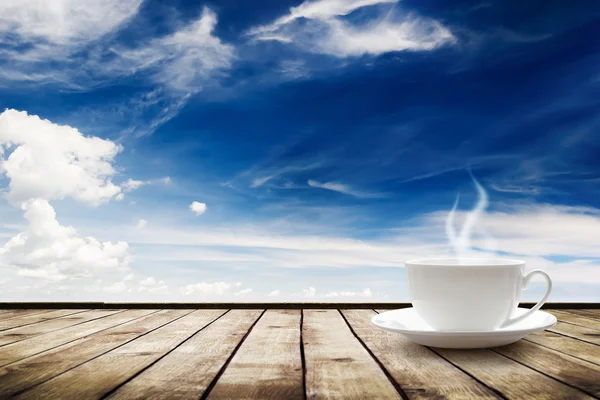 Cup with hot drink on table — Stock Photo, Image