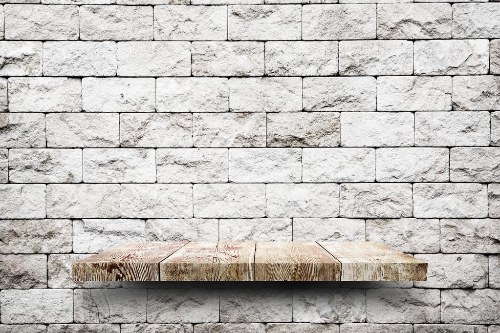 Wooden shelf on brick wall Stock Photo by ©robertsrob 67484703