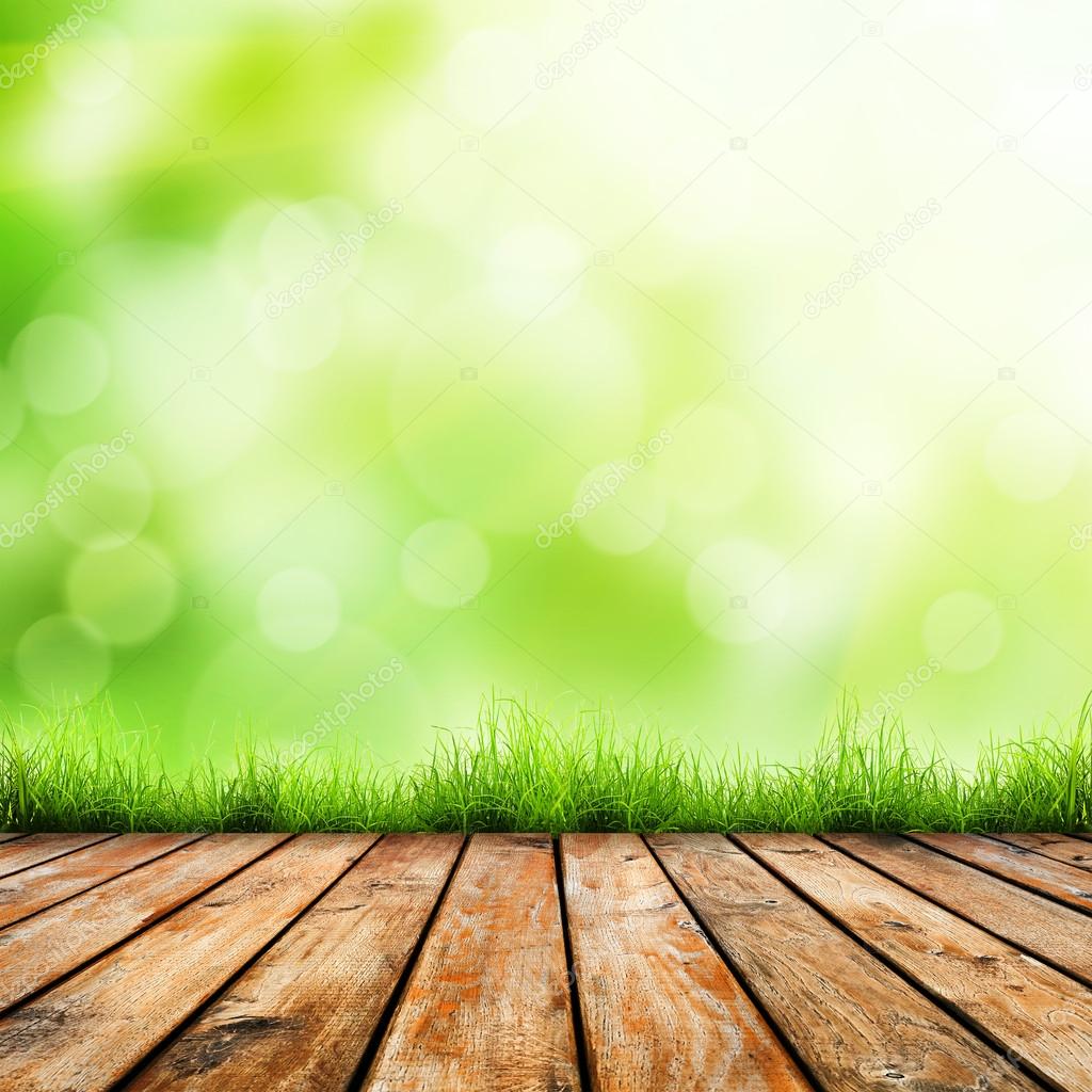 Green grass  and wood floor.
