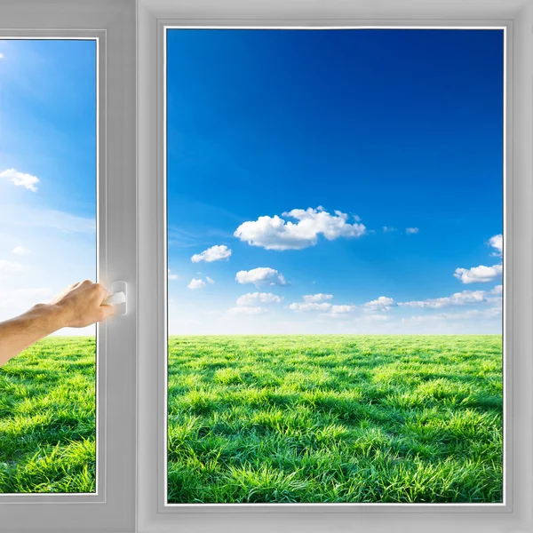Hand open window with view of the field — Stock Photo, Image