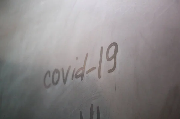 Word Coronavirus Written Fogged Bathroom Window Partial Blur Close — Stock Photo, Image