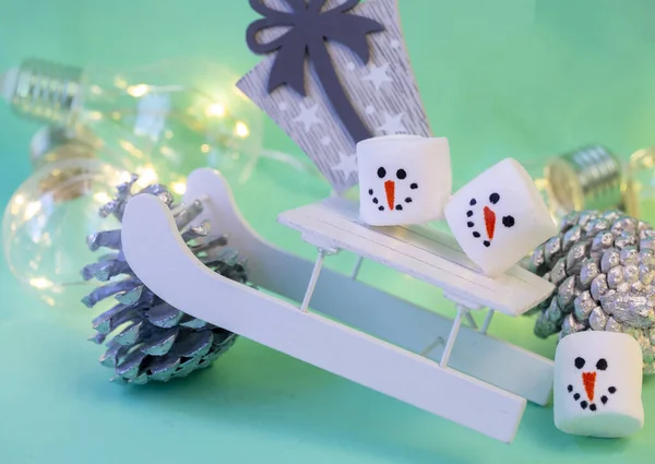 Marshmallow Snowmen Ride Sled Turquoise Background Close Christmas Decorations — Stock Photo, Image