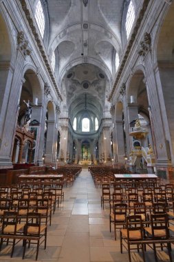 PARIS, FRANCE - JULY 23, 2011: People visit Saint Sulpice church in Paris. It is located in Latin Quartier, 6th arrondissement of Paris.