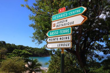 Guadeloupe destinations sign: directions to Deshaies, Basse-Terre and Pointe Noire.