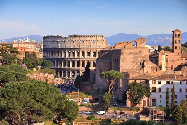 Colosseum in Rome city, Italy. Rione Monti - cityscape with Colosseum in Monti district, Rome.