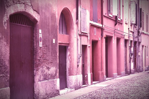 Modena, Italy - Emilia-Romagna region. Colorful Mediterranean architecture. Cross processed color tone - retro image filtered style.