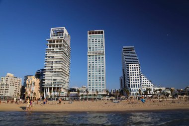 TEL AVIV, ISRAEL - NOVEMBER 2, 2022: People visit Allenby Beach (also known as Jerusalem Beach) in Tel Aviv, Israel. Tel Aviv is the economic and technological center of Israel.