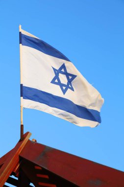 Flag of Israel in the wind. Israeli national colors.