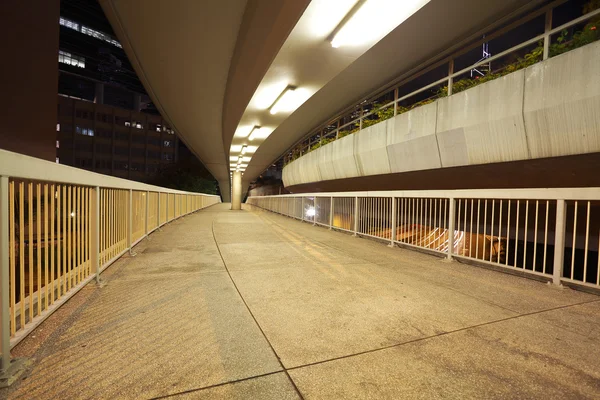 Pedestrian bridge perspective  long corridor of night — Stock Photo, Image