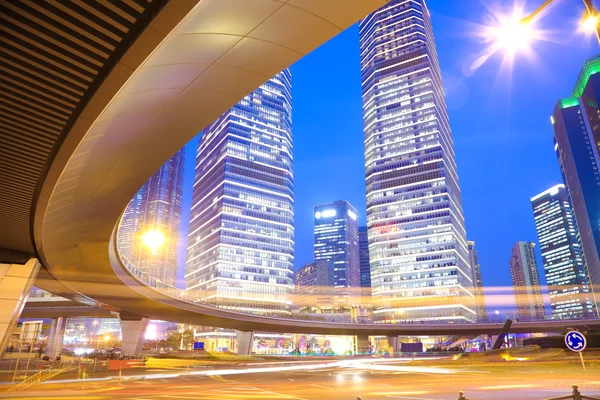 The highway bridge car light trails of shanghai modern urban bui — Stock Photo, Image