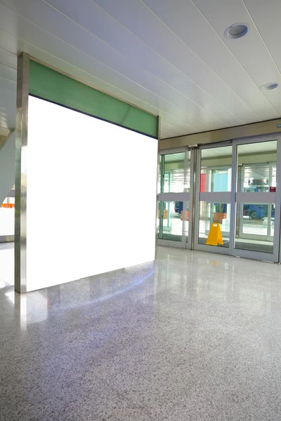 Airport exit door glass wall corridor wall lightboxes — Stock Photo, Image