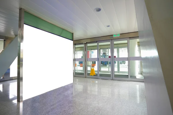 Airport exit door glass wall corridor wall lightboxes — Stock Photo, Image