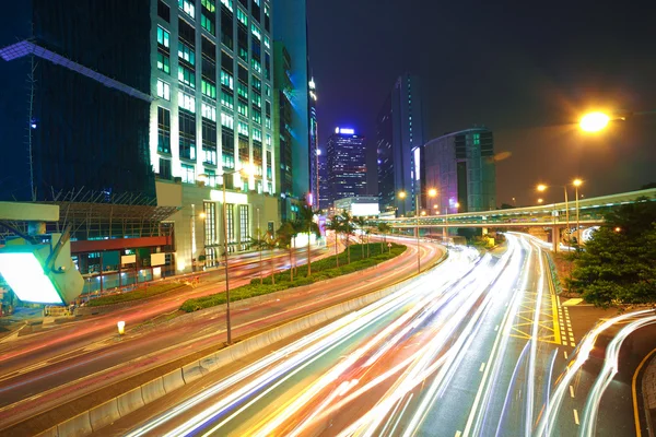 Road light trails on streetscape buildings backgrounds in HongKo — Stock Photo, Image