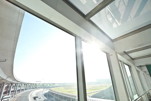 Sunny on modern glass office windows building interior corridor — Stock Photo, Image