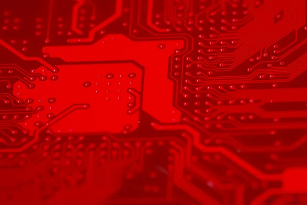 Närbild av röda elektroniska moderkortet krets med processor — Stockfoto