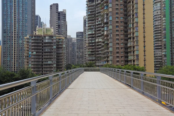 Modern city buildings background with empty road floor — Stock Photo, Image