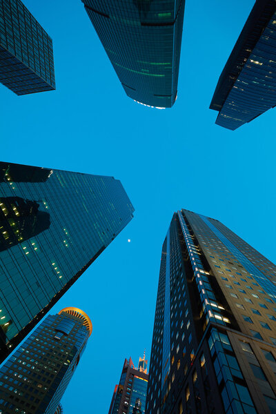Looking up at Shanghai modern city buildings backgrounds of night scene