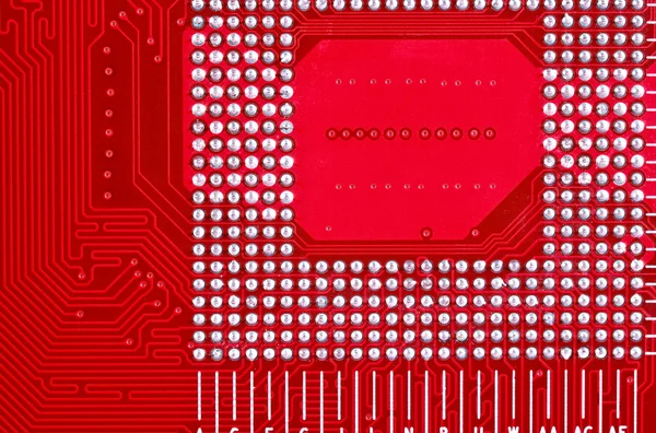 Red circuit board texture background of computer motherboard