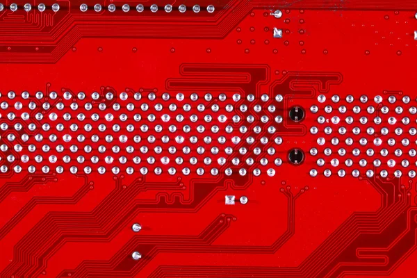 Red circuit board texture background of computer motherboard