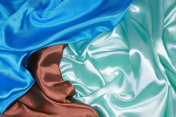 Marrón y verde claro y azul Paño de seda de respaldo abstracto ondulado —  Fotos de Stock