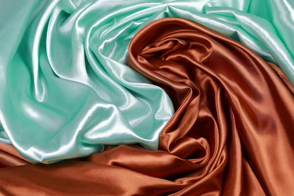 Brown and light green Silk cloth of wavy abstract backgrounds