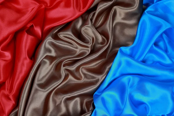 Brown and red and blue Silk cloth of wavy abstract backgrounds — Stock Photo, Image