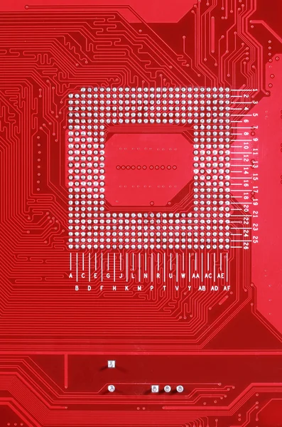 Red circuit board texture background of computer motherboard