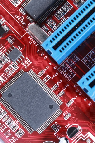 Close-up of electronic circuit red board with processor of compu