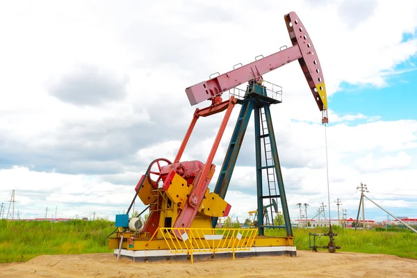 Pink Oil pump of crude oilwell rig — Stock Photo, Image