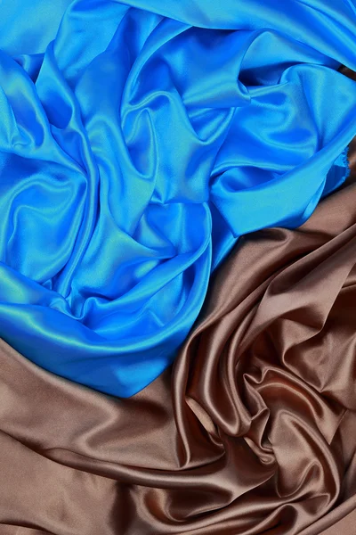 蓝色和棕色的波浪褶皱纹理背景丝缎布 — 图库照片
