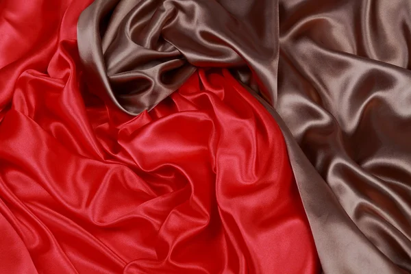 Brown and red silk satin cloth of wavy folds texture background — Stock Photo, Image