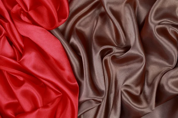 Brown and red silk satin cloth of wavy folds texture background — Stock Photo, Image