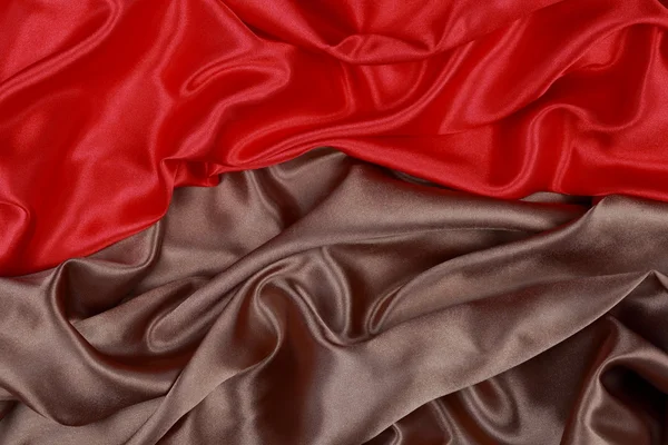 Brown and red silk satin cloth of wavy folds texture background — Stock Photo, Image