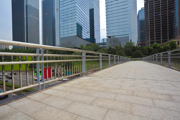 Empty road surface with modern city buildings background — Stock Photo, Image